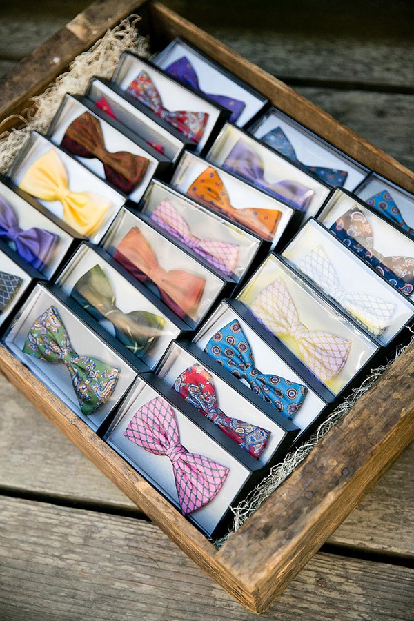 These brightly coloured bow ties are a wearable wedding favour | Larissa Cleveland Photography via Style Me Pretty