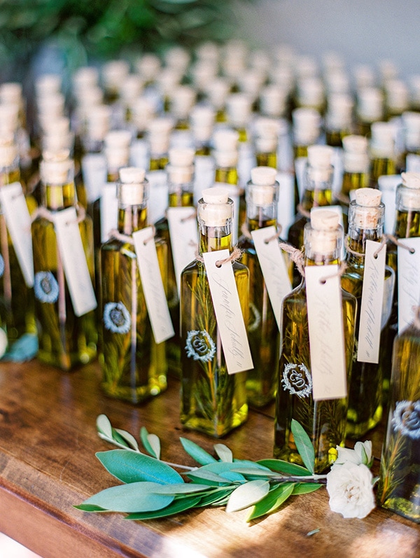 Elegant bottled olive oil wedding favors featuring the couple's monogram for a European inspired celebration | The Grovers via MODwedding