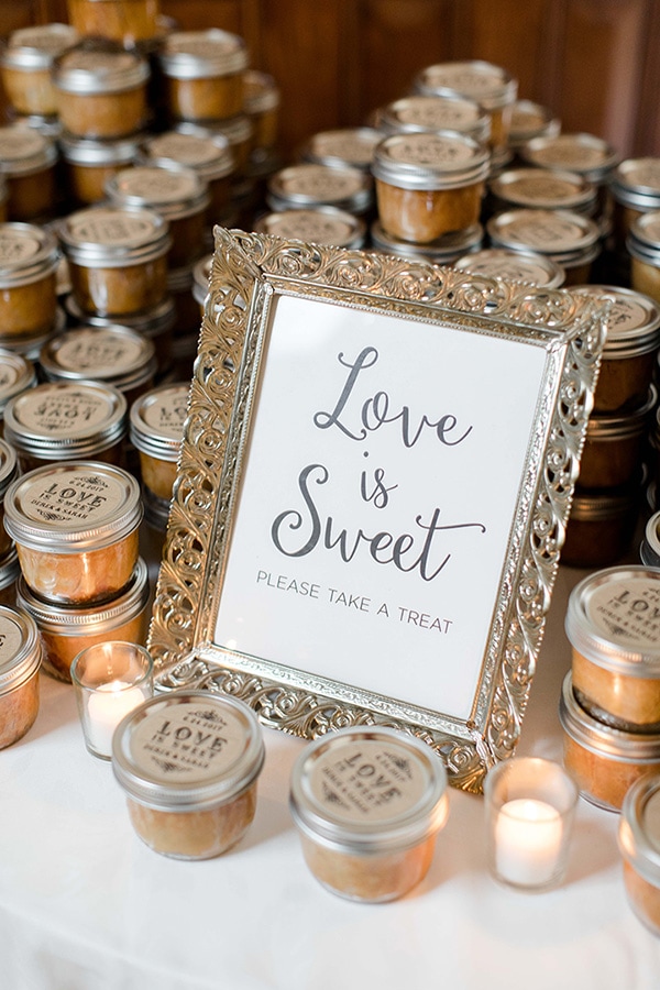 'Love is sweet, please take a treat' wedding favours in rustic vintage glass jars | Jessica Frey Photography via My Hotel Wedding