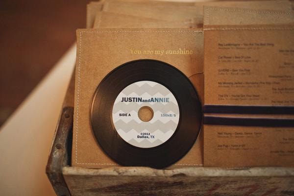 Vinyl record inspired music compilation of the couple's favourite songs as a wedding favor for guests | Taylor Lord Photography via Style Me Pretty