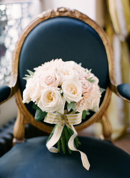 Elegant cream rose wedding bouquet on navy vintage chair | KT Merry via Style Me Pretty