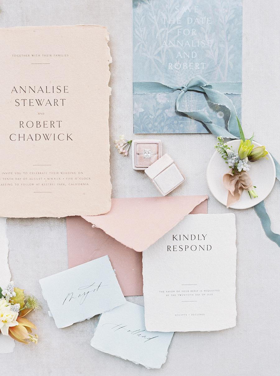 Spring Pastel Wedding Ideas | Romantic pastel wedding invitation suite in pale blue, blush pink and peach with torn edge paper and vintage inspired fine black lettering. | Photography: Anya Kernes via Style Me Pretty